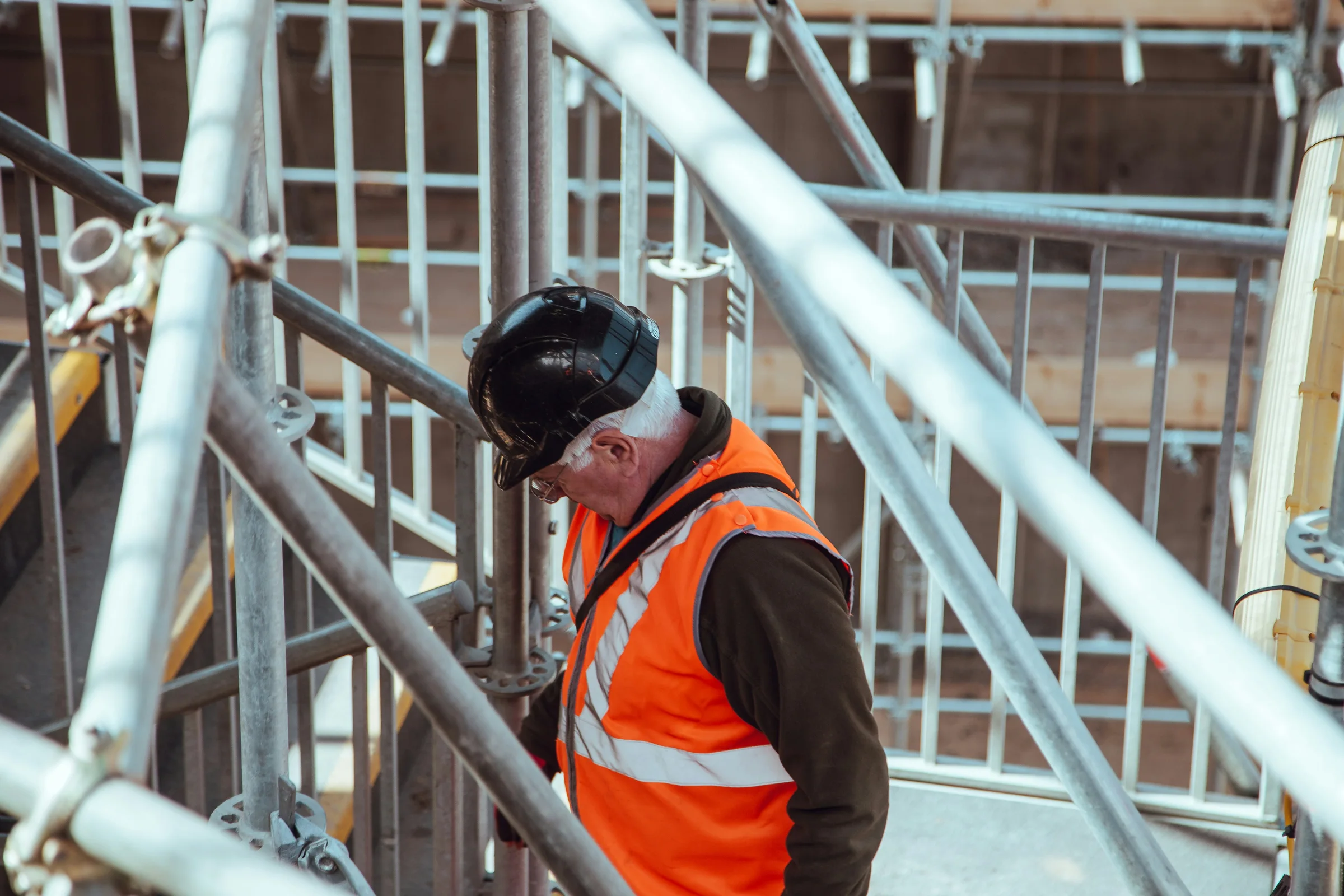 Construction worker in high-visibility clothing on a London site — illustrative stock photography
